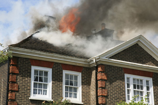 Active fire coming from rooftop of house